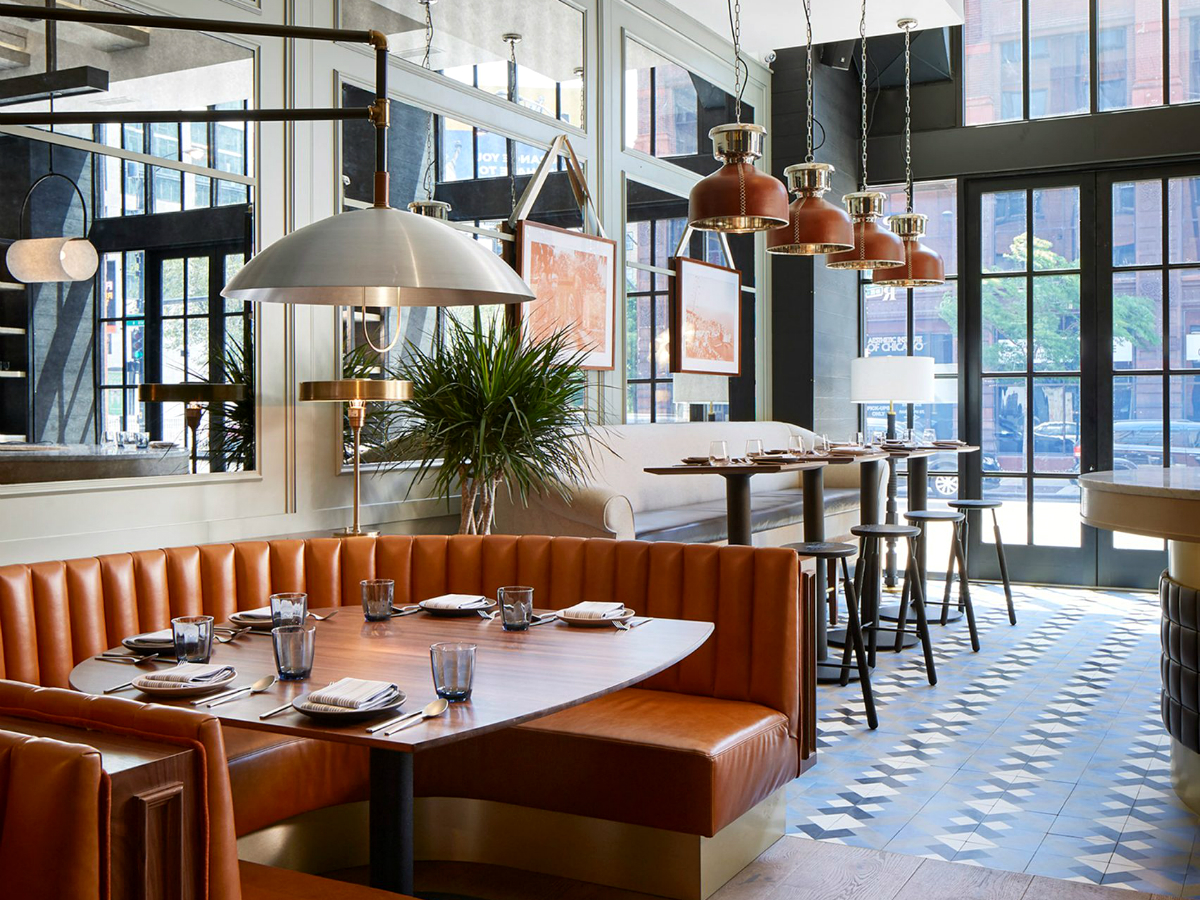 An Old Printing House Turns Into a Mesmerizing Restaurant | The place was transformed into a marvelous place full of mid-century lamps that hang above burnt orange leather booths. #interiordesign #restaurantdesign #restaurantdecor #decorideas #midcenturyideas