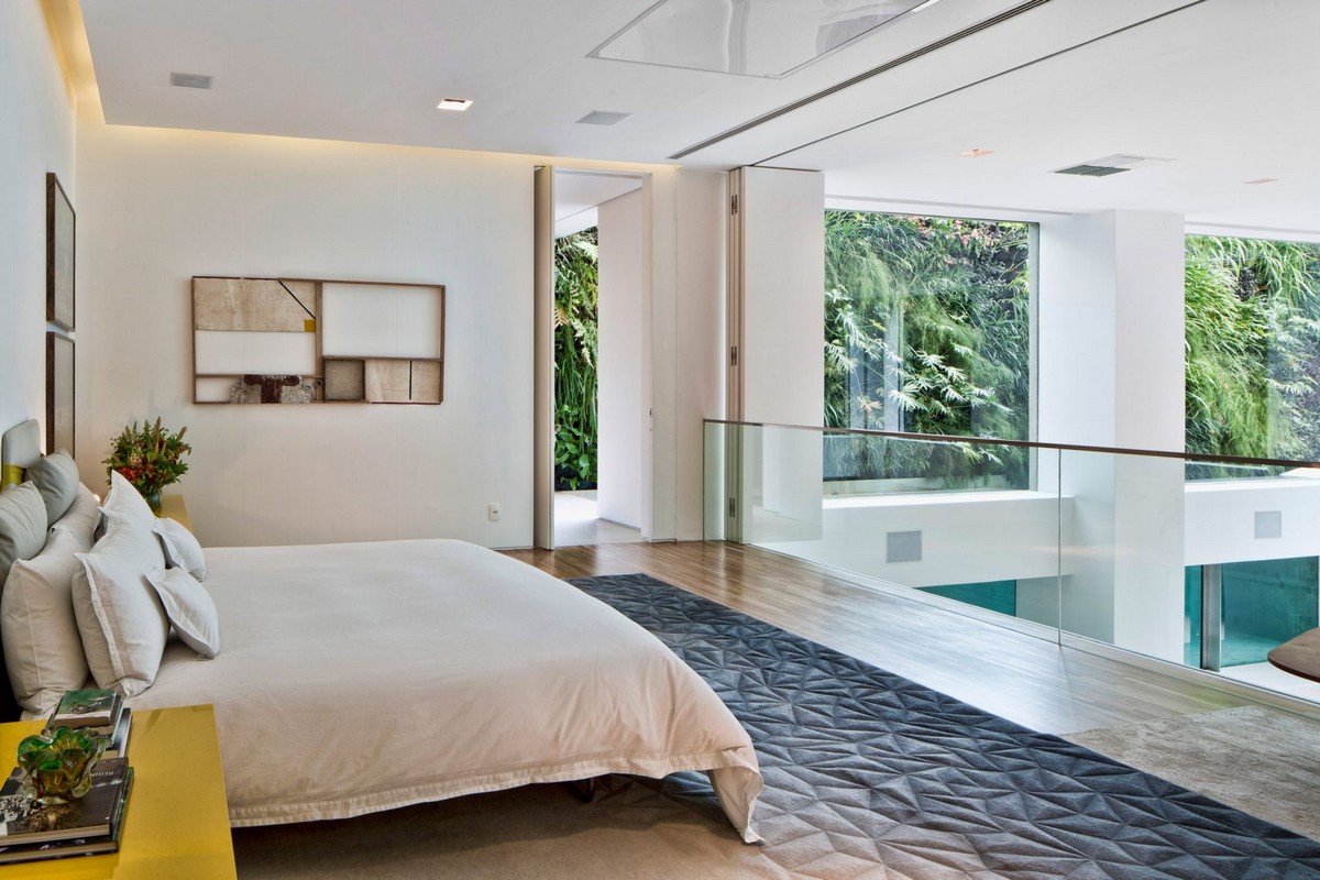 Ever Wished of Having a Pool Inside Your Home? Here's How | In an outstanding residence in São Paulo, Brazil, swimmers can be seen from the room through thick glass panels, like fish in an aquarium. #interiordesign #innovation #insidepool #homedecor